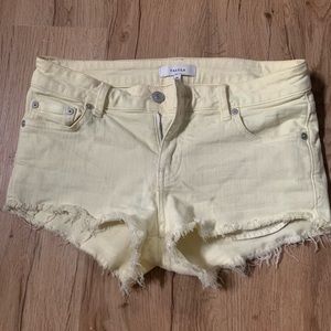 ARITZIA TALULA pale yellow denim cut-off shorts